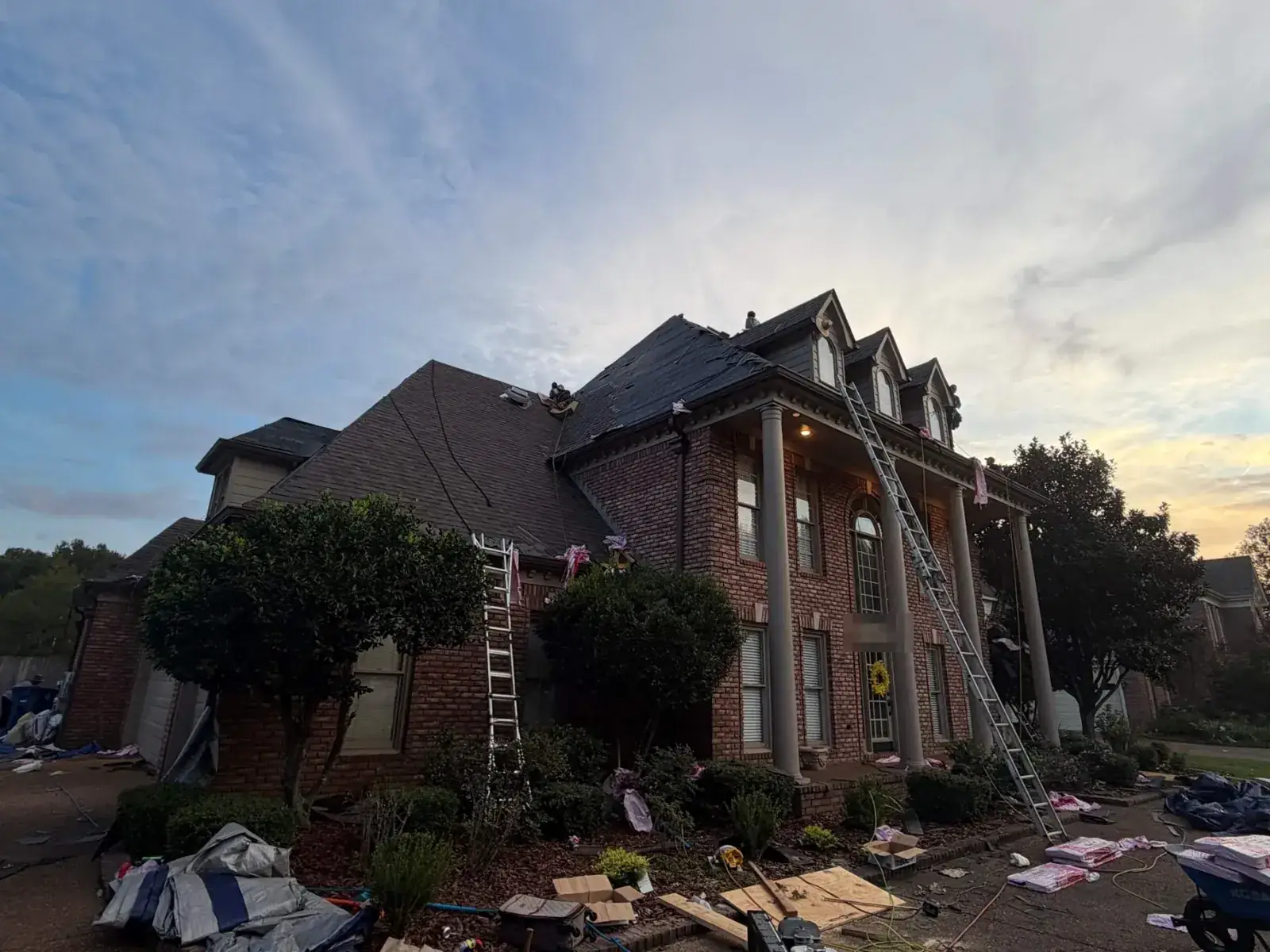 Metro crew roofing a colonial home
