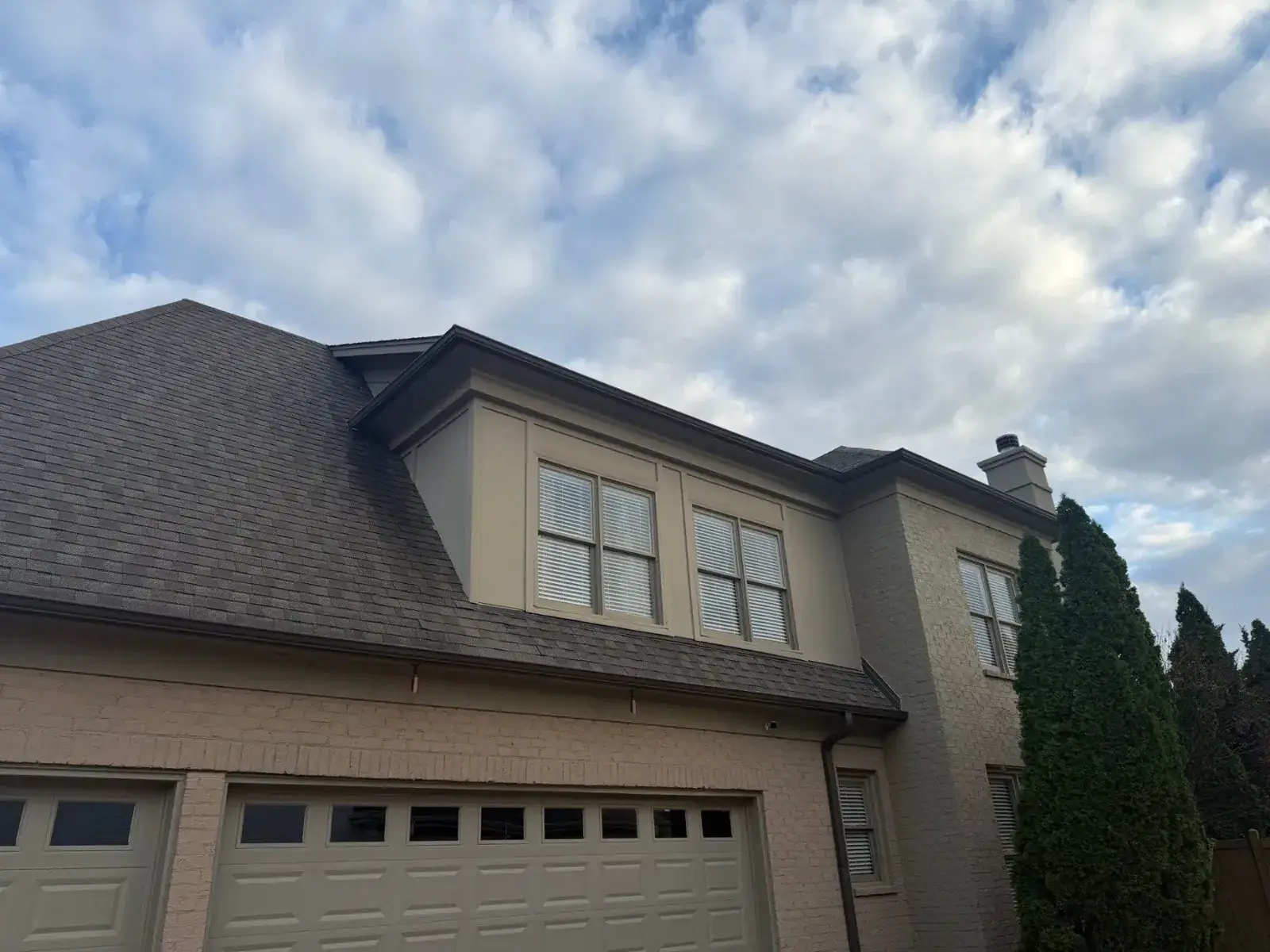 New shingle roof on a large brick home